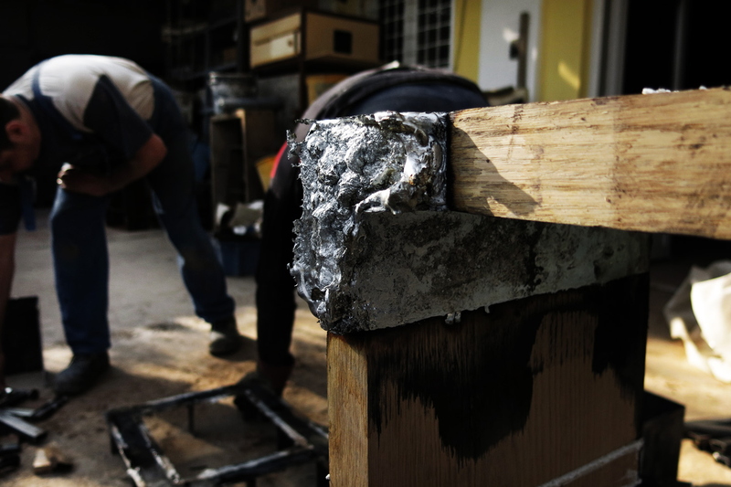 Illustration for article titled Casting Molten Metal On Wood With a Hungarian Design Master